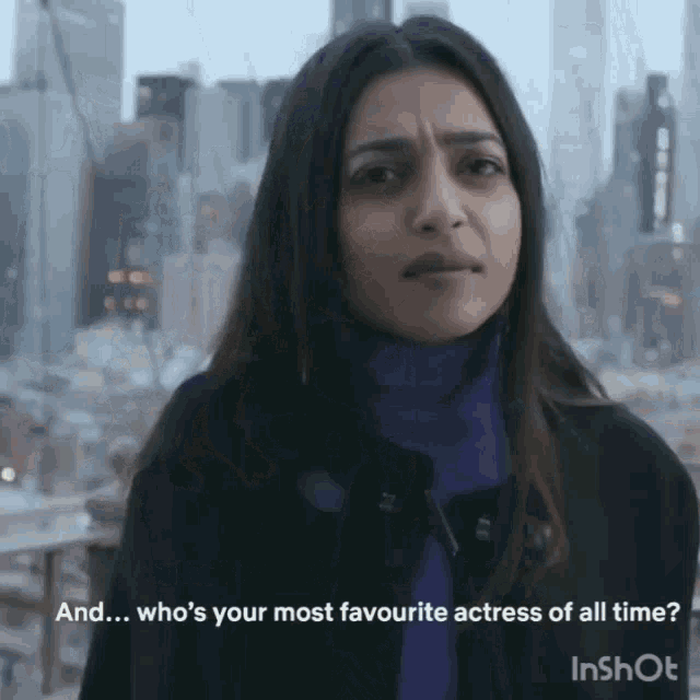 a woman in a purple turtleneck is being asked who is her most favourite actress of all time