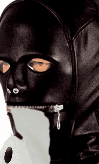a person wearing a black mask with a zipper