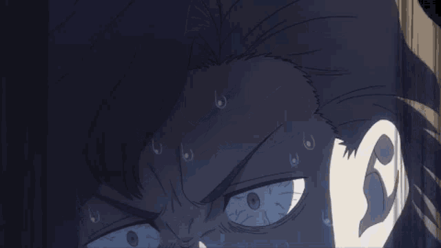a close up of a person 's face with sweat coming out of their face