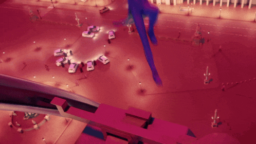 a girl in a purple hoodie stands on a ledge overlooking a city