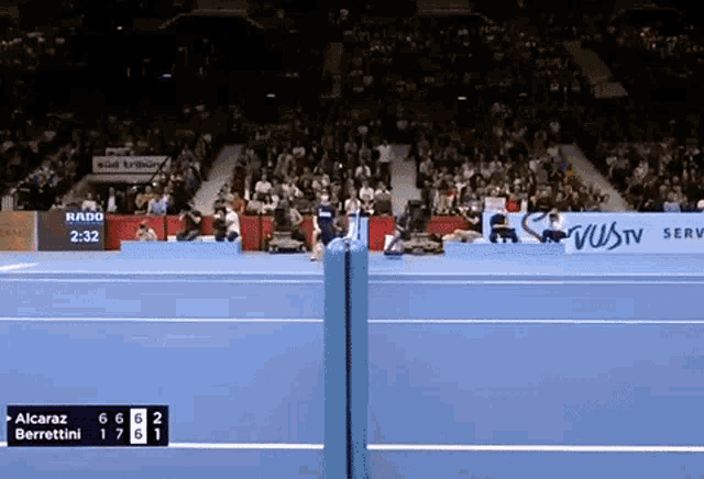 a tennis match between alcaraz and berrettini is being played