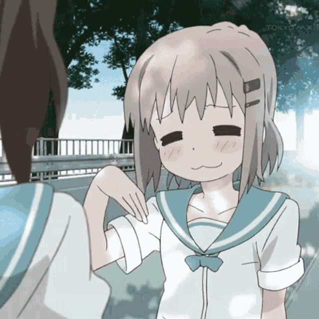 a girl in a sailor suit is smiling and looking at another girl