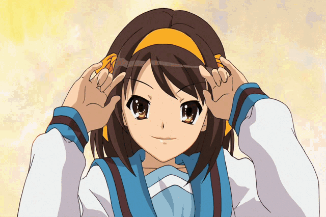 a girl with brown hair and a yellow headband making a peace sign
