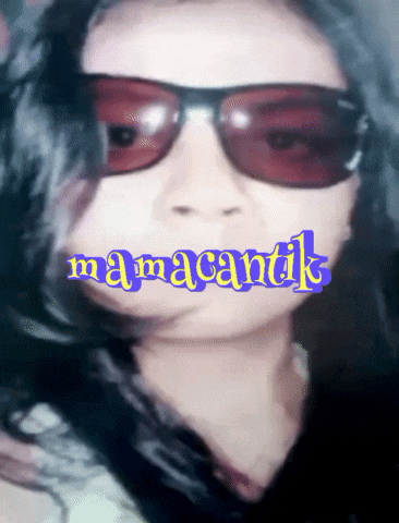 a close up of a woman wearing sunglasses and the word mamacantik