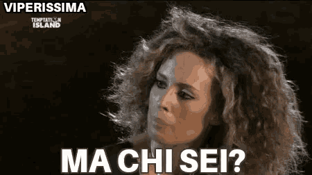 a woman with curly hair is making a funny face and asking , `` ma chi sei ? ''