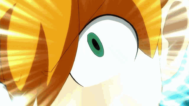 a close up of a cartoon character 's eye with a green pupil