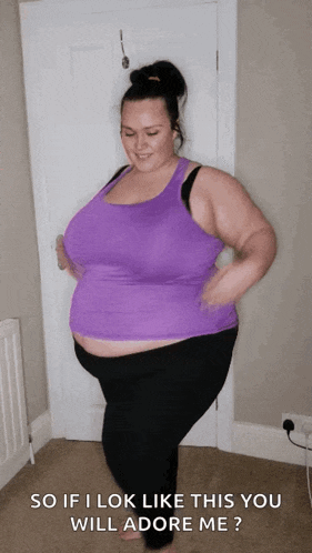a woman in a purple tank top and black pants says " so if i look like this you will adore me ? "
