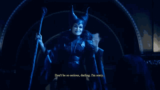 a woman in a maleficent costume is saying " don 't be so serious darling "