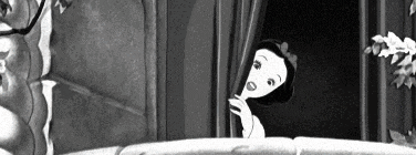 a black and white photo of snow white peeking out of a window .