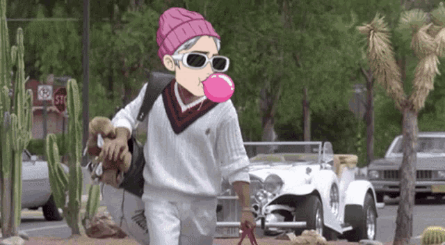 a person wearing sunglasses and a pink hat blowing a pink bubblegum