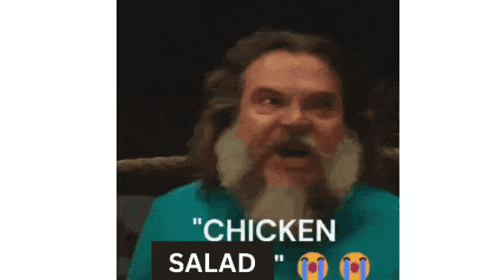 a man with a beard says " chicken salad " in a video