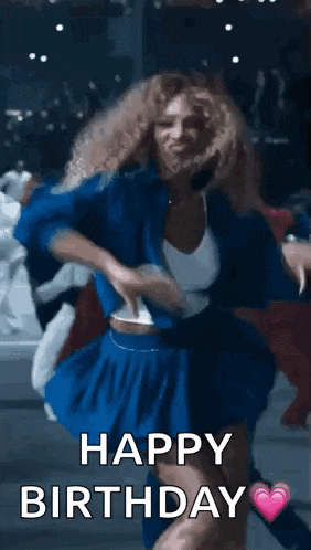 a woman in a blue dress is dancing with the words `` happy birthday '' .