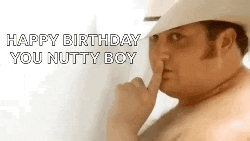 a shirtless man in a cowboy hat is making a shhh gesture .