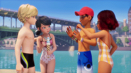 a group of kids in swimsuits are standing next to each other on the beach .