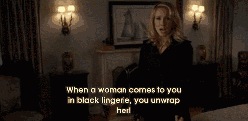 a woman in black lingerie with the words when a woman comes to you in black lingerie you unwrap her on the bottom
