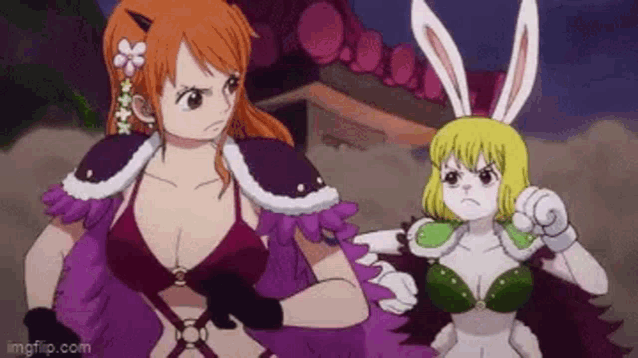 a couple of anime characters standing next to each other .