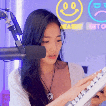 a woman is playing a keyboard in front of a neon sign that says " get off "