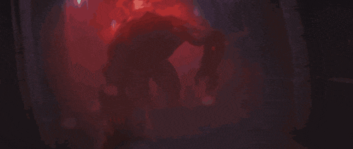a red background with a silhouette of a person with a sword