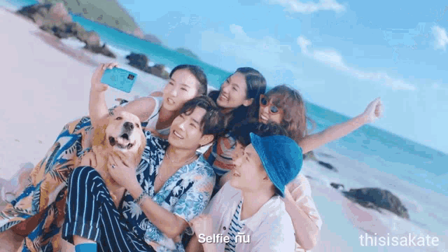 a group of people are taking a selfie with a dog