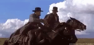 Cowboys Riding Horses GIF - Cowboys Riding Horses Handshake GIFs