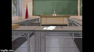 a girl sits at a desk in front of a chalkboard in a classroom ..