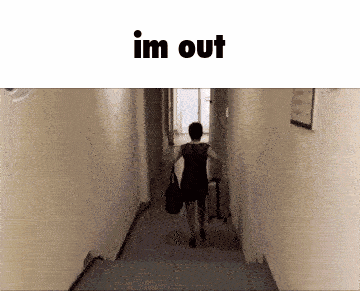 a woman in a black dress is walking down a hallway with the words im out below her
