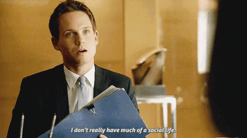 a man in a suit and tie is holding a blue folder and saying i don 't really