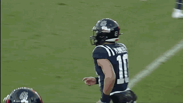 a football player with the number 10 on his jersey is running on the field