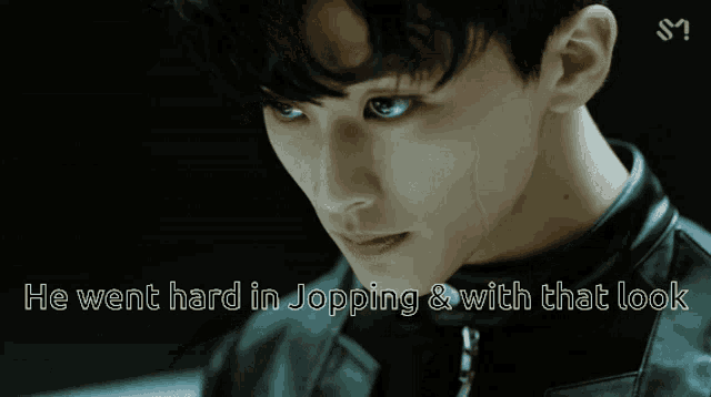 a close up of a man 's face with the words he went hard in jopping and with that look