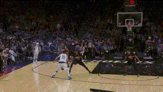 a basketball game is being played in front of a tissot logo