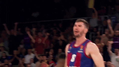 a basketball player with the number 8 on his jersey is celebrating