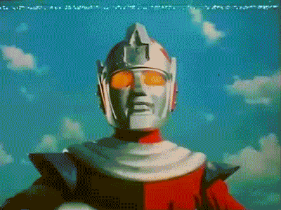 a cartoon character with a helmet on stands in front of a blue sky with clouds