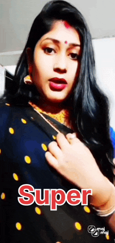 a woman in a blue and gold polka dot saree with the word super on it