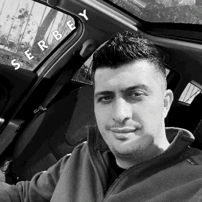 a black and white photo of a man in a car with serbiey written on the side door