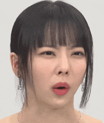 a close up of a woman making a funny face