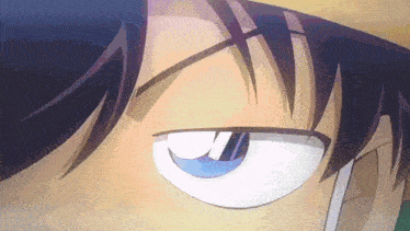 a close up of a person 's eye with a purple eyebrow