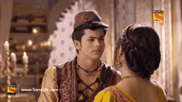 a man and a woman are looking at each other with the sony sab logo visible