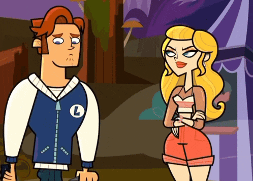 a man and a woman are standing next to each other and the man has a letter l on his jacket