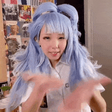 the girl is wearing a blue wig and a white shirt .