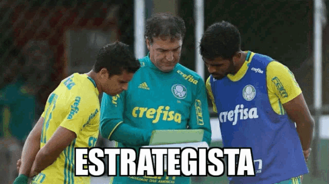 three soccer players wearing crefisa jerseys are looking at something