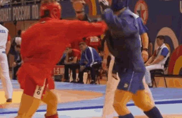 two wrestlers are fighting in front of a sign that says " chat poccha no "