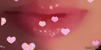 a close up of a woman 's lips with pink hearts coming out of them .