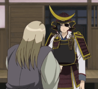 a man in a samurai armor stands next to another man
