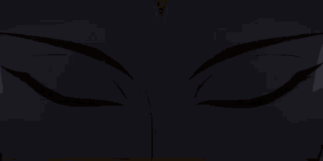 a close up of a cartoon character 's face with glowing eyes and a flame on his forehead .