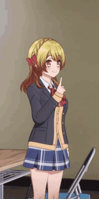 a girl in a school uniform giving a thumbs up sign