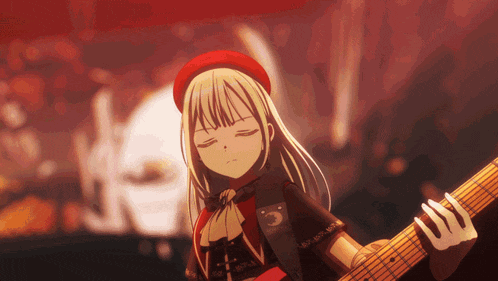 a girl in a red hat is holding a guitar with her eyes closed