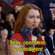 a woman speaking into a microphone with the words sexy confident so intelligent on the bottom