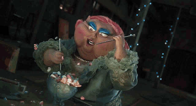 a cartoon character with pink hair and blue eye makeup