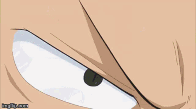 a close up of a man holding a sword in his mouth .
