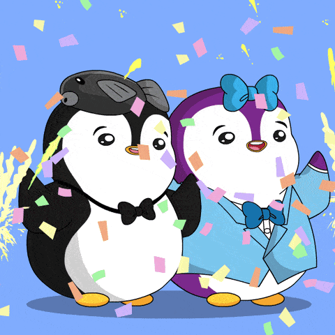 a couple of penguins with confetti falling around them